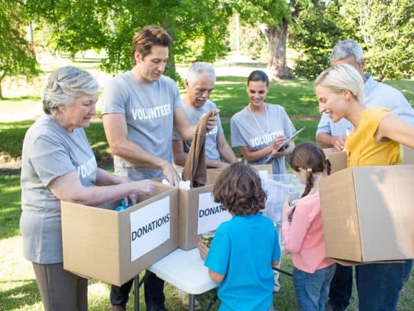 A group of volunteers handing out donations.